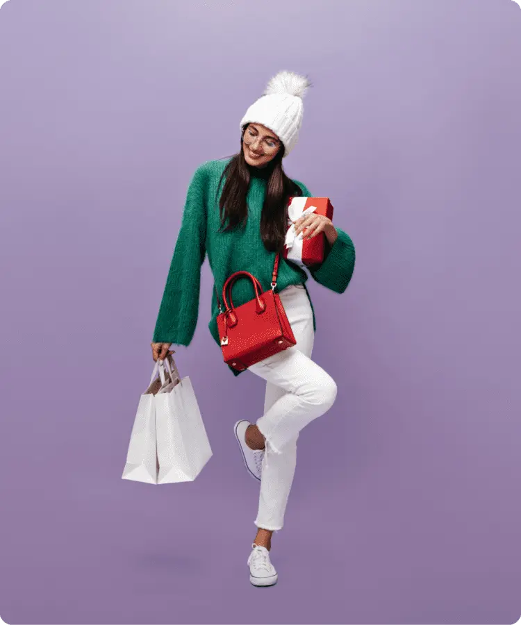 Kvinde med shoppingposer og gaveæske, symbol på bekvem online shopping med ViaBill.